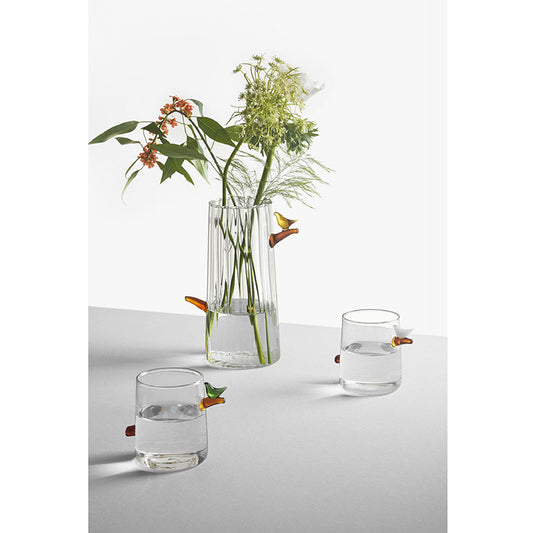 Ichendorf Milano Birds glass vase with amber bird, styled with flowers and matching tumblers, handmade borosilicate glass
