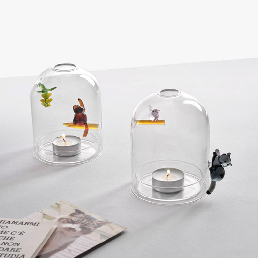 Styled image of Ichendorf Milano windproof candle holders, monkey and bananas and cat and bird motifs, artistic borosilicate glass, 12.5 x 9cm, whimsical home decor