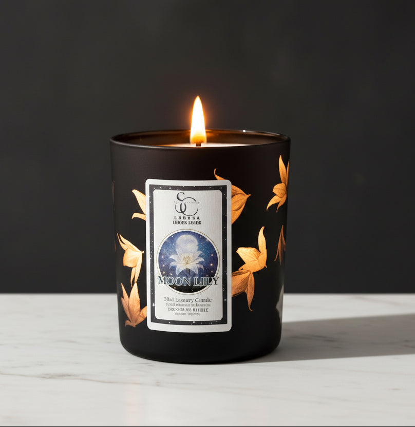 Black candle with a label on a white surface and dark background