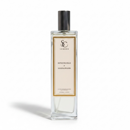 Honeysuckle & Sandalwood 100ml luxury room spray by Soulful Candles London in a clear glass bottle with silver cap and white gold label