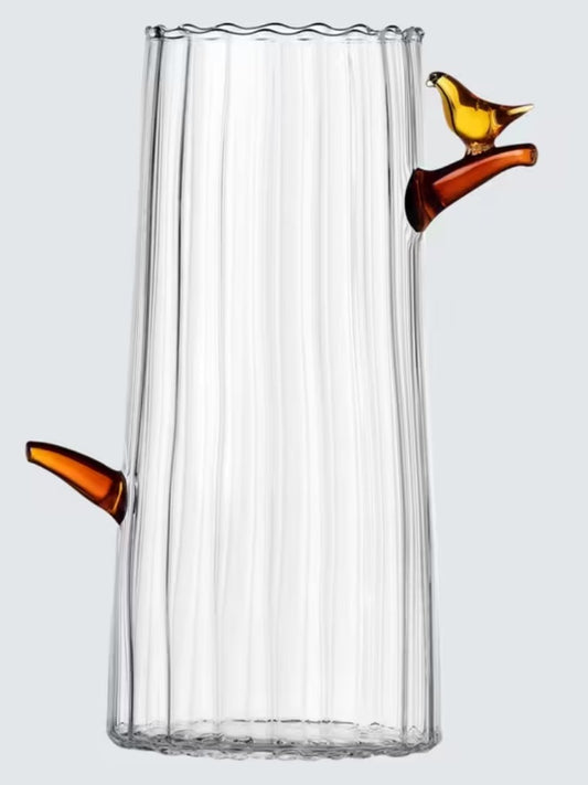 Close-up of Ichendorf Milano Birds glass vase with amber bird accent, designed by Tomoko Mizu, modern Italian art glass