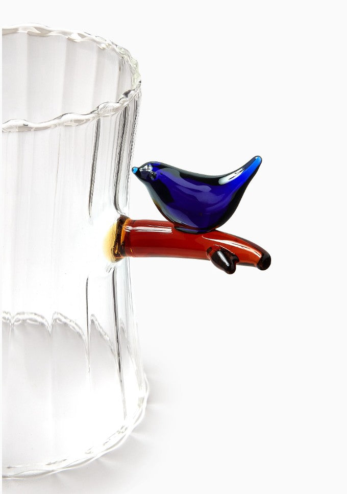 Close-up of blue bird detail on Ichendorf Milano Birds Tealight, designed by Tomoko Mizu, artisan borosilicate glass, 12.5 x 9cm