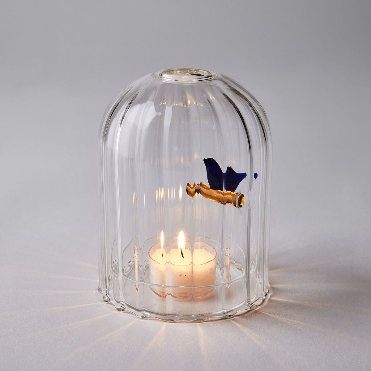 Ichendorf Milano windproof candle holder with blue bird, handmade borosilicate glass lantern, tealight burning inside, designed by Tomoko Mizu