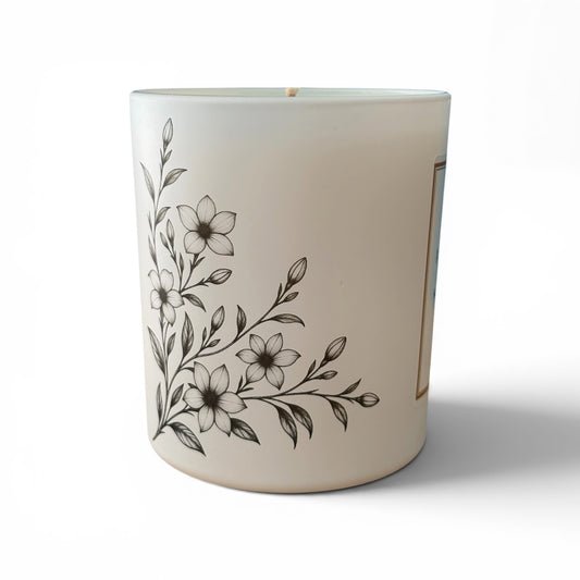 Jasmine and Soft Amber candle in matt white coated glass with floral engraving