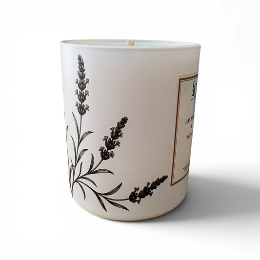 Lavender and Tonka candle with delicate botanical engravings on matt white glass