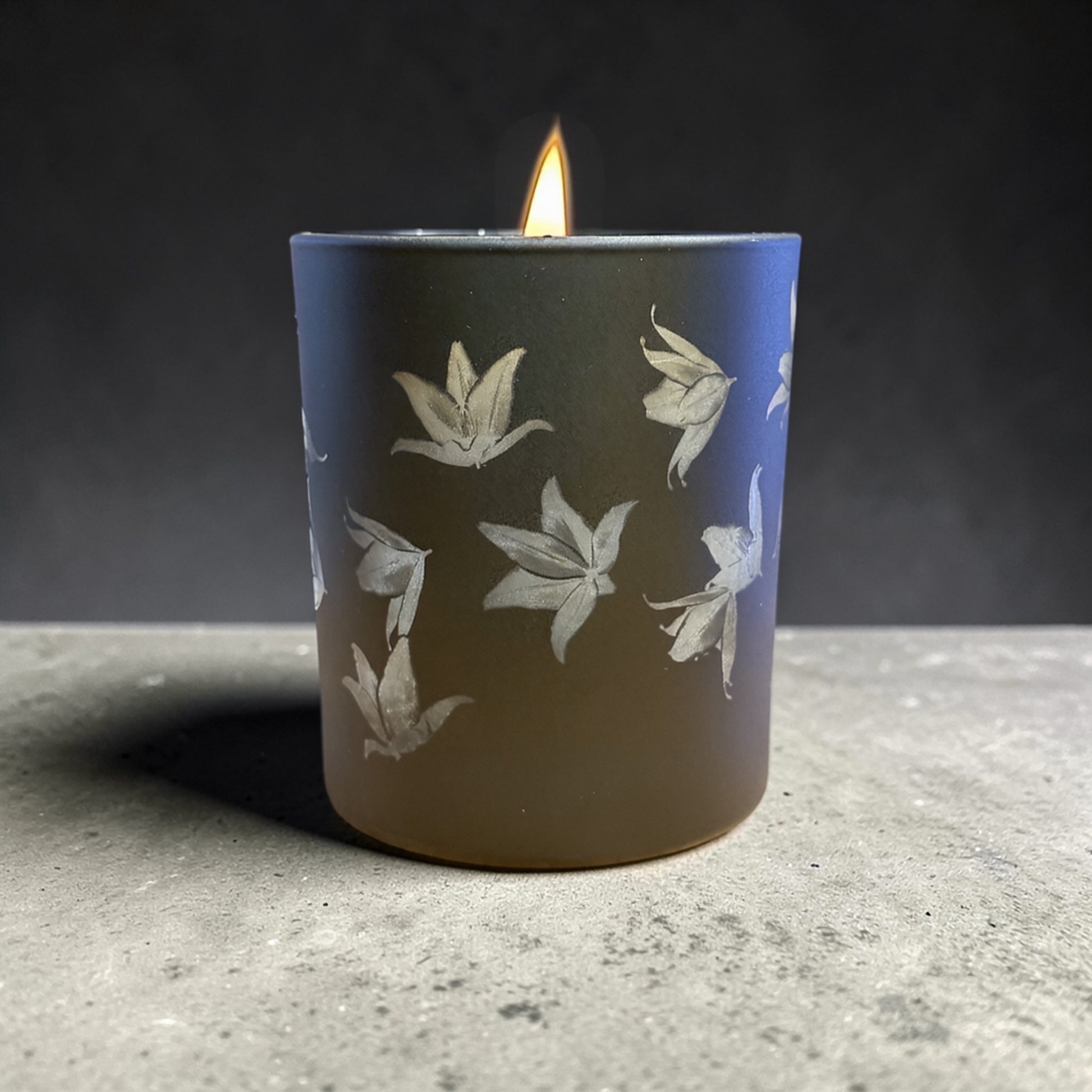 Moon Lily engraved candle lit – lily engraving glowing on black glass