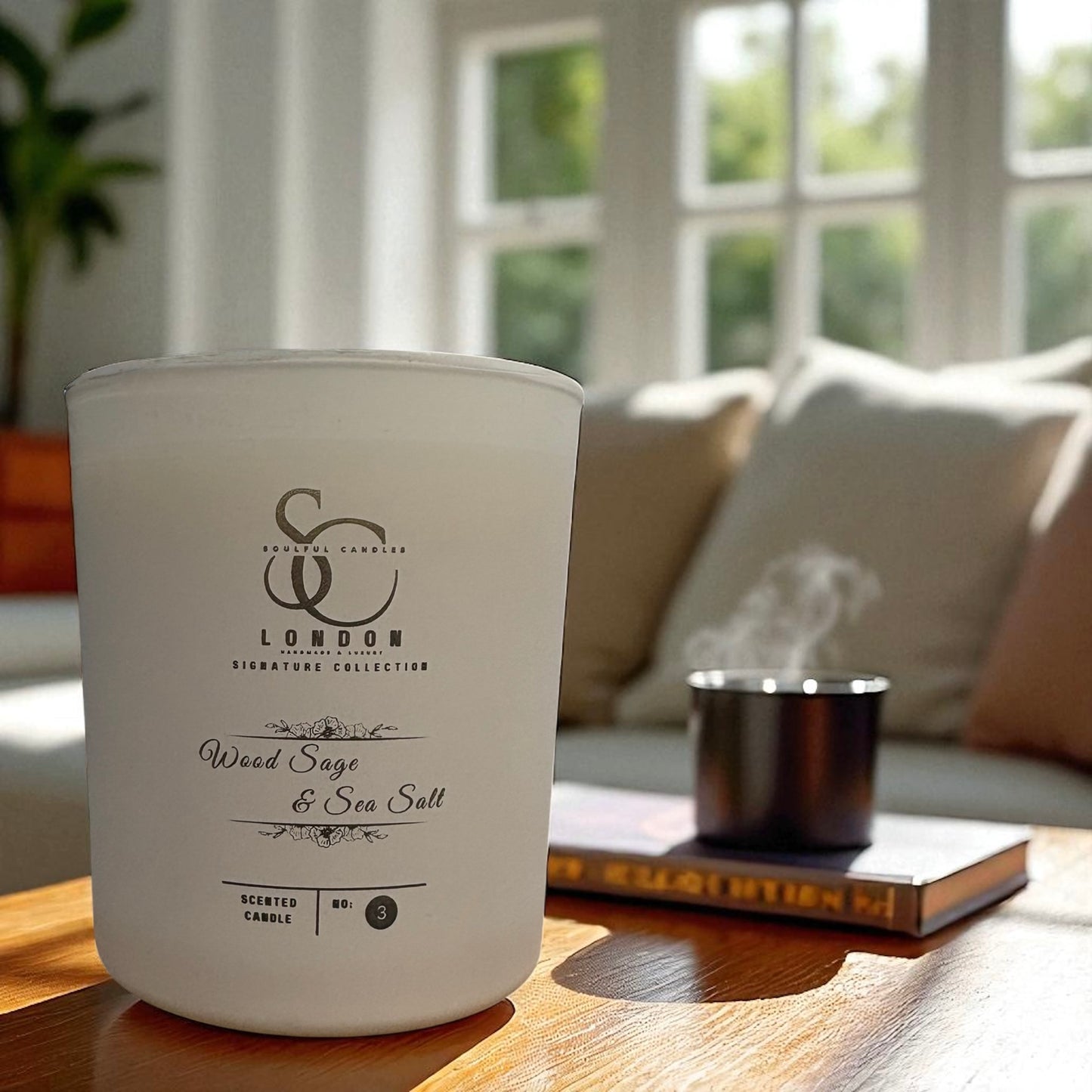 White candle with branding on a wooden surface in a bright room