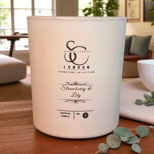 luxury White glass jar candle with 'SC London' branding on a wooden surface in a home setting