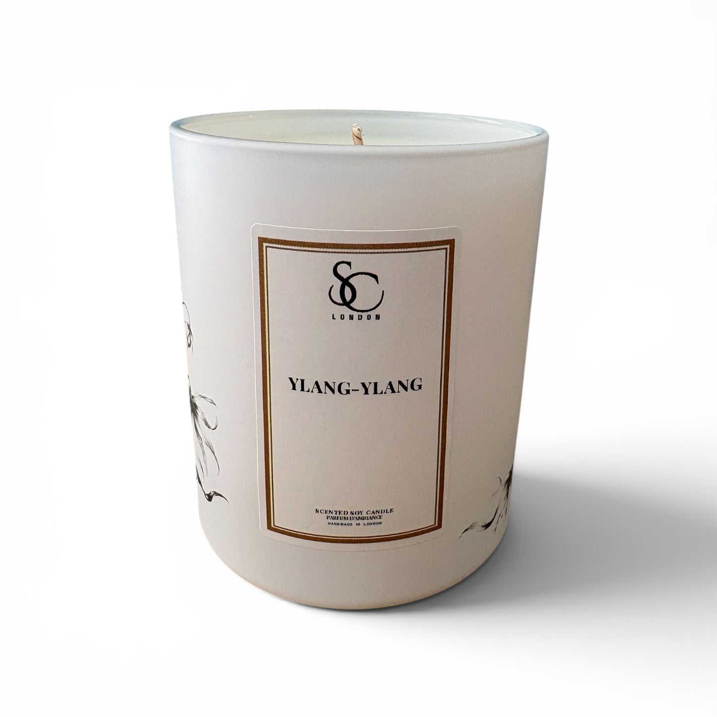A frosted white glass jar candle with a cream-colored label and a single wick, featuring the brand name 'Soulful Candles London' and scent name 'YLANG-YLANG' on a clean white background.