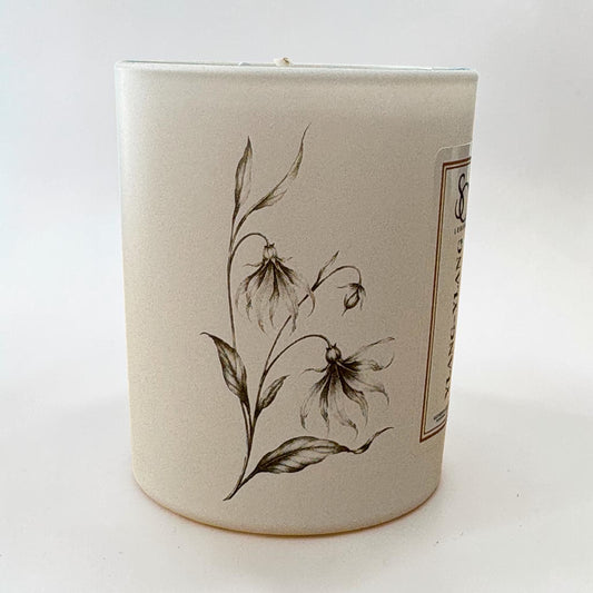 Ylang Ylang 9cl candle showing delicate floral engravings around the glass