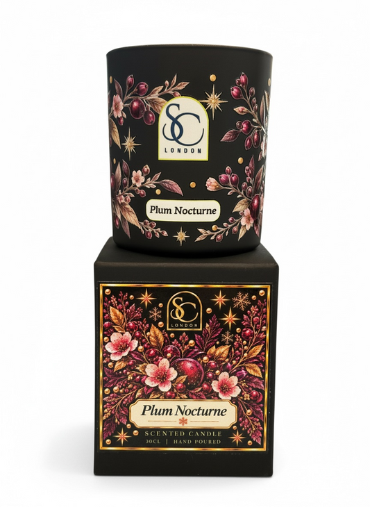 Plum Nocturne 30cl scented soy candle by Soulful Candles London, featuring burgundy floral and berry artwork with gold stars on black glass, displayed on its matching gift box.